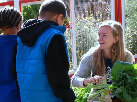 Student intern working in school garden